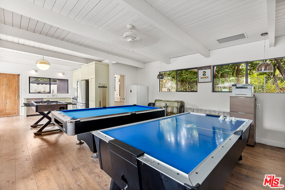 5401 Ostrom Avenue Encino, CA 91316 - Photo 53 of 73 a room with pool table and windows