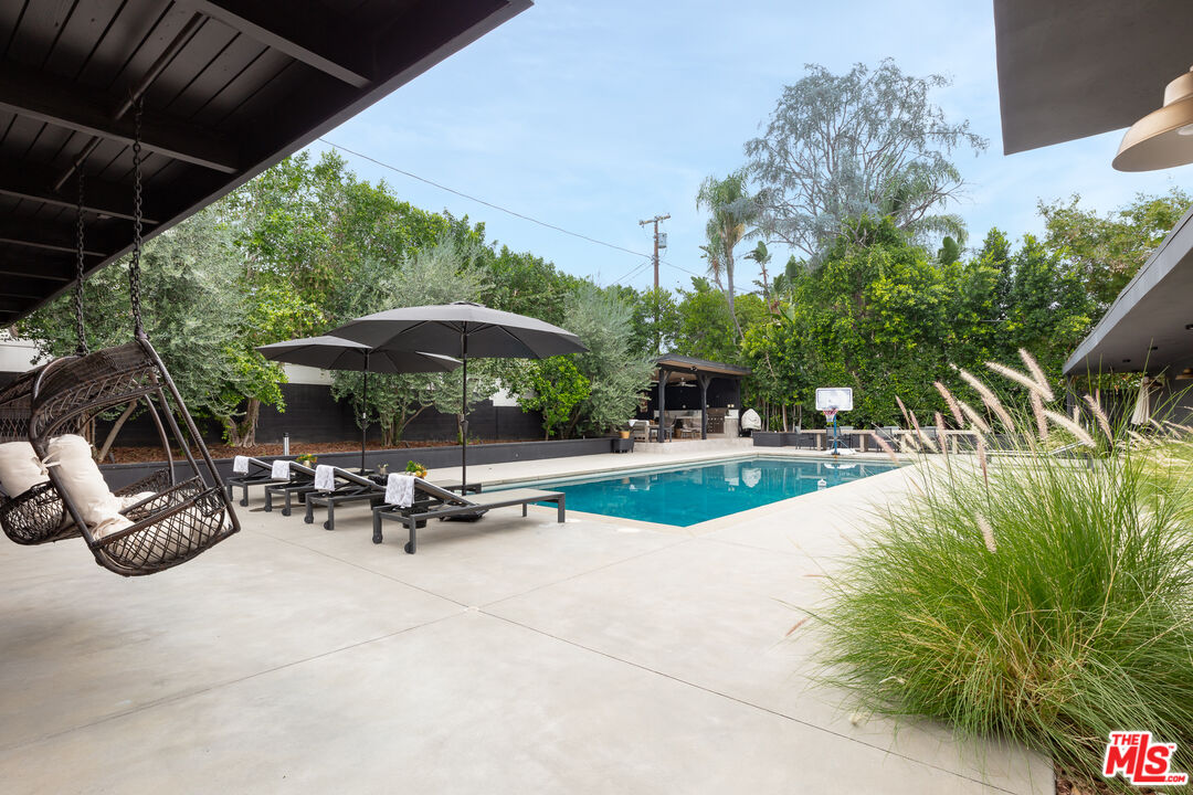 5401 Ostrom Avenue Encino, CA 91316 - Photo 59 of 73 a view of swimming pool with sitting area and furniture