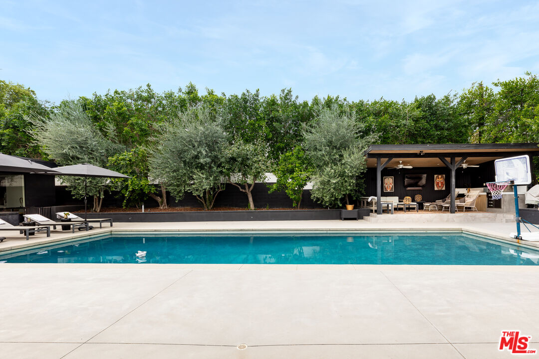 5401 Ostrom Avenue Encino, CA 91316 - Photo 60 of 73 a view of a house with swimming pool and sitting area