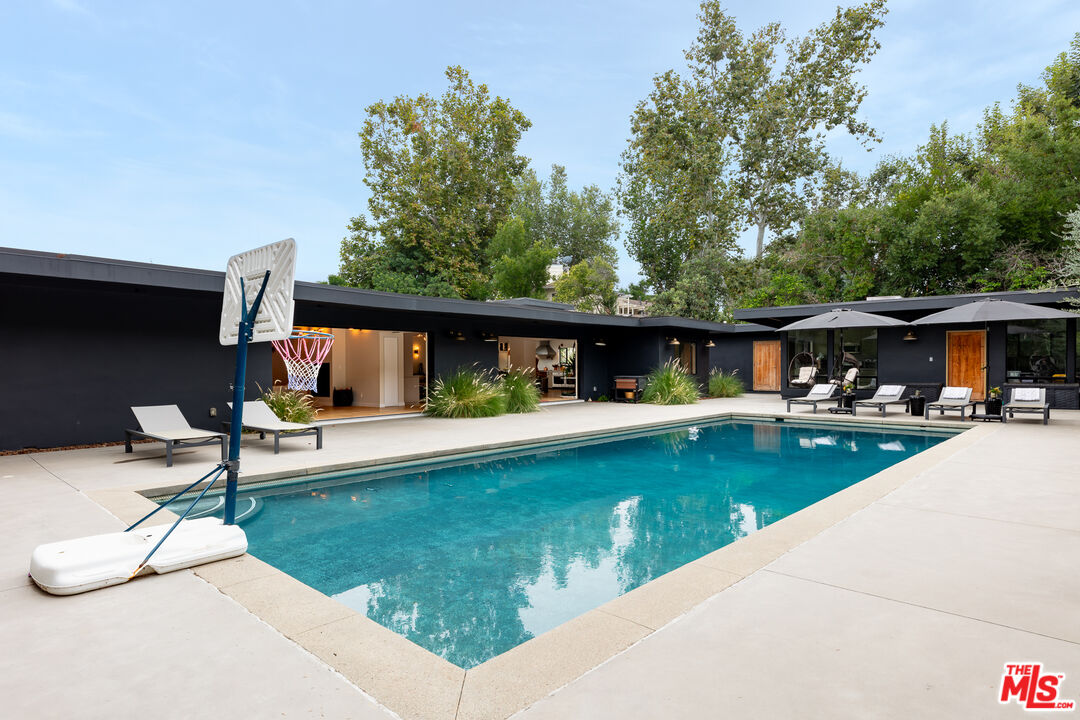 5401 Ostrom Avenue Encino, CA 91316 - Photo 63 of 73 a view of swimming pool with chairs
