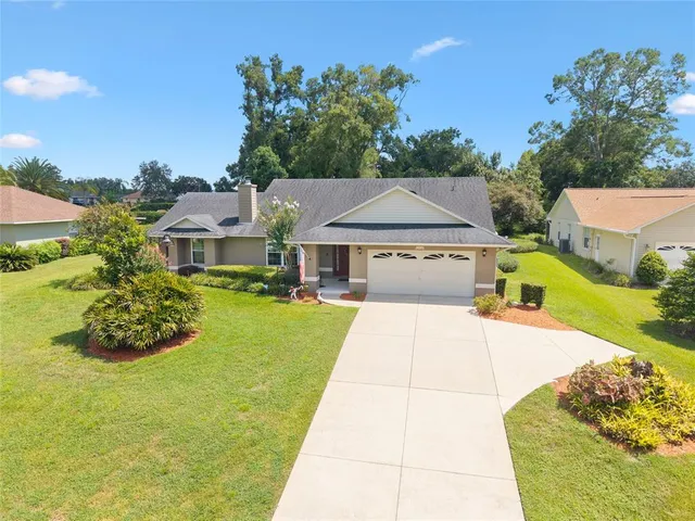 a house with swimming pool in front of it