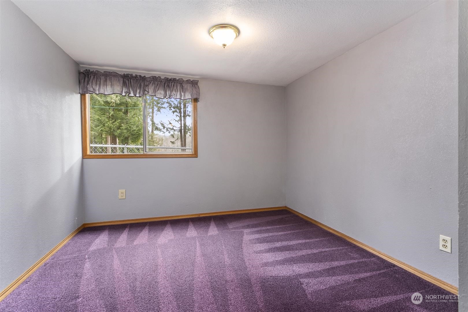 3397 Cedarville Road Bellingham, WA 98226 - Photo 26 of 38 an empty room with wooden floor and windows