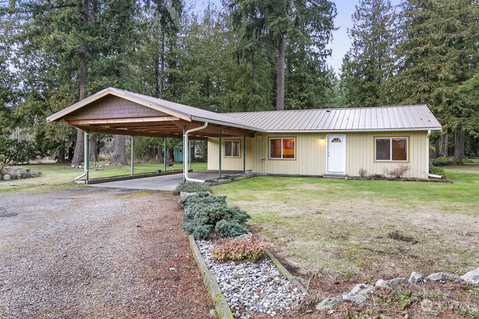 3397 Cedarville Road Bellingham, WA 98226 - Photo 30 of 38 a front view of a house with a garden