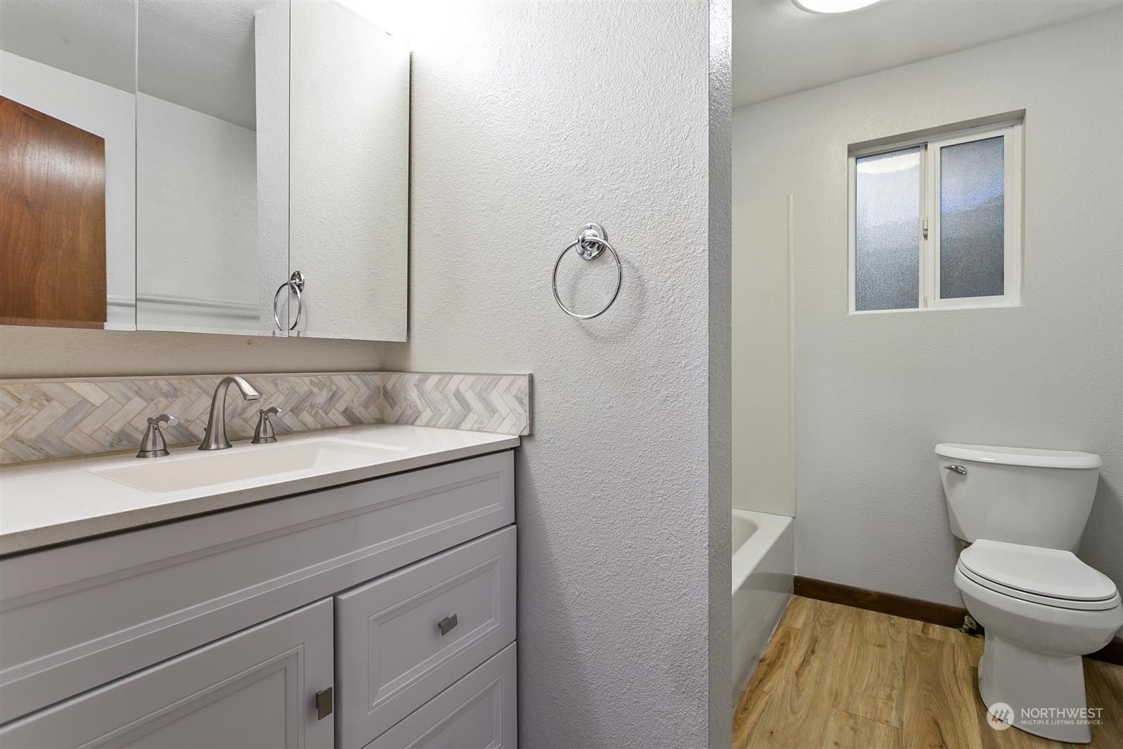 3397 Cedarville Road Bellingham, WA 98226 - Photo 37 of 38 a bathroom with a granite countertop toilet sink and mirror