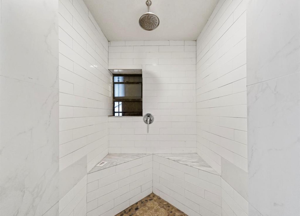 1207 Firnat Street Houston, TX 77022 - Photo 16 of 21 a bathroom with a shower