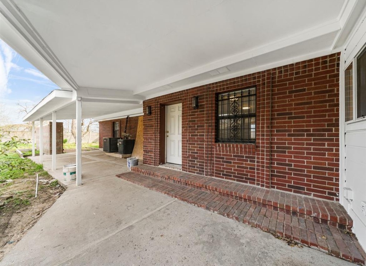 1207 Firnat Street Houston, TX 77022 - Photo 6 of 21 a view of a brick house with an outdoor space