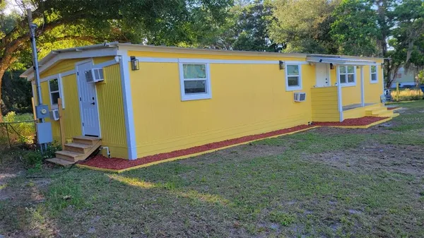 a view of a backyard with a small cabin