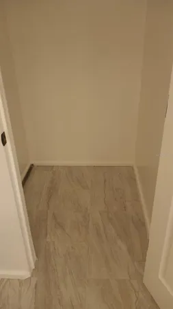 a view of a door and chair in the balcony