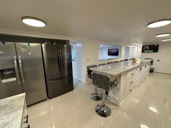 a view of an empty room with a fireplace