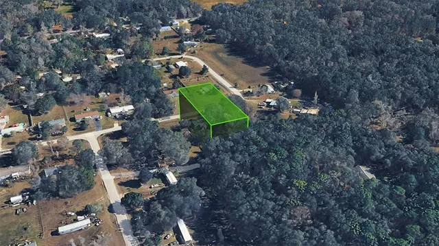 a aerial view of a house with a yard