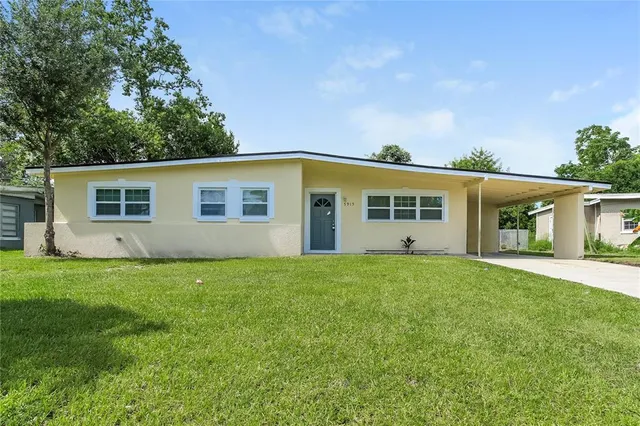 front view of a house with a yard
