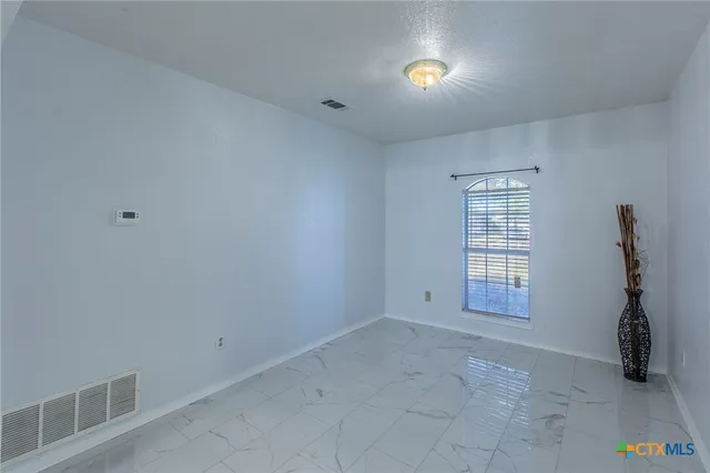 an empty room with windows