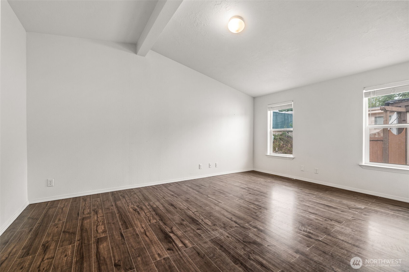 2101 South 324th Street, Unit 14 Federal Way, WA 98003 - Photo 17 of 38 an empty room with wooden floor and windows
