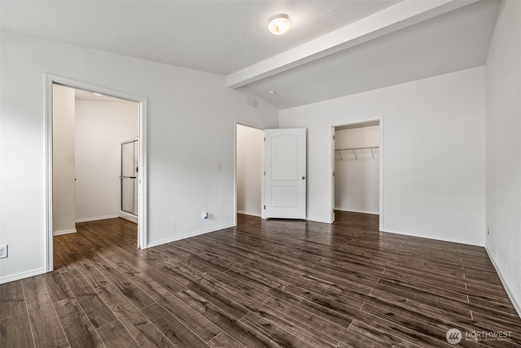 2101 South 324th Street, Unit 14 Federal Way, WA 98003 - Photo 18 of 38 a view of an empty room with wooden floor and a fireplace