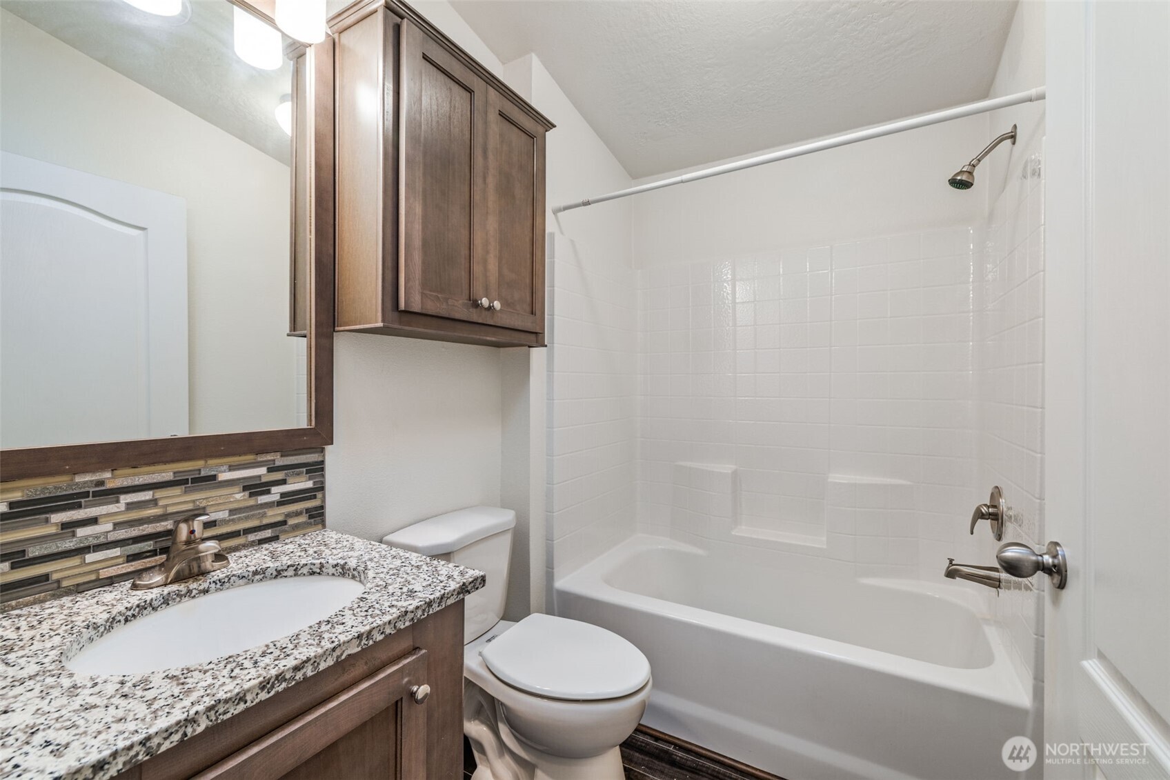 2101 South 324th Street, Unit 14 Federal Way, WA 98003 - Photo 25 of 38 a bathroom with a granite countertop sink toilet and shower
