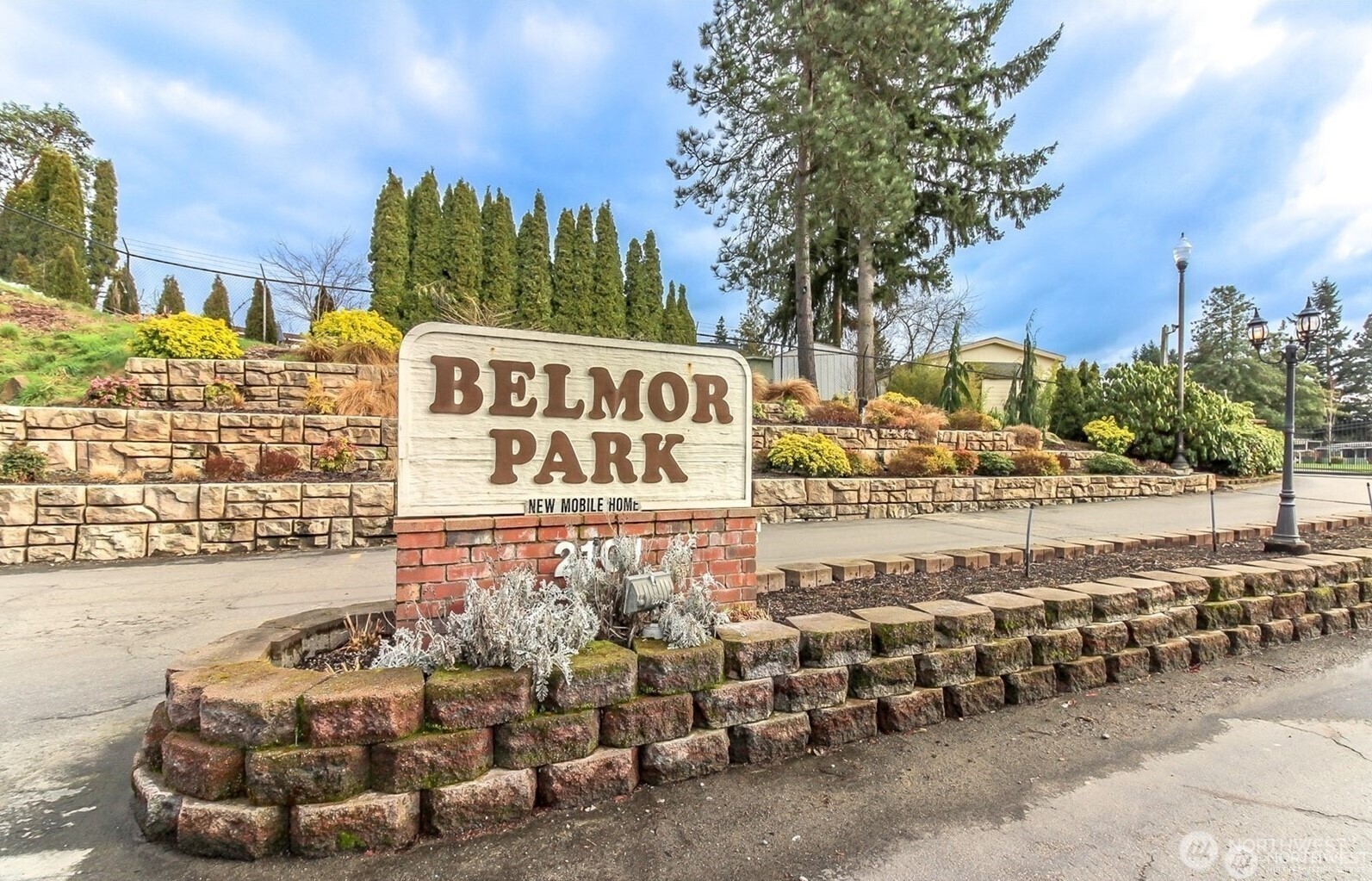 2101 South 324th Street, Unit 14 Federal Way, WA 98003 - Photo 31 of 38 a street sign on a sidewalk next to a building