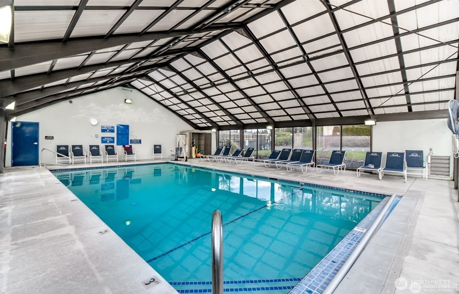 2101 South 324th Street, Unit 14 Federal Way, WA 98003 - Photo 35 of 38 a view of swimming pool with a outdoor seating