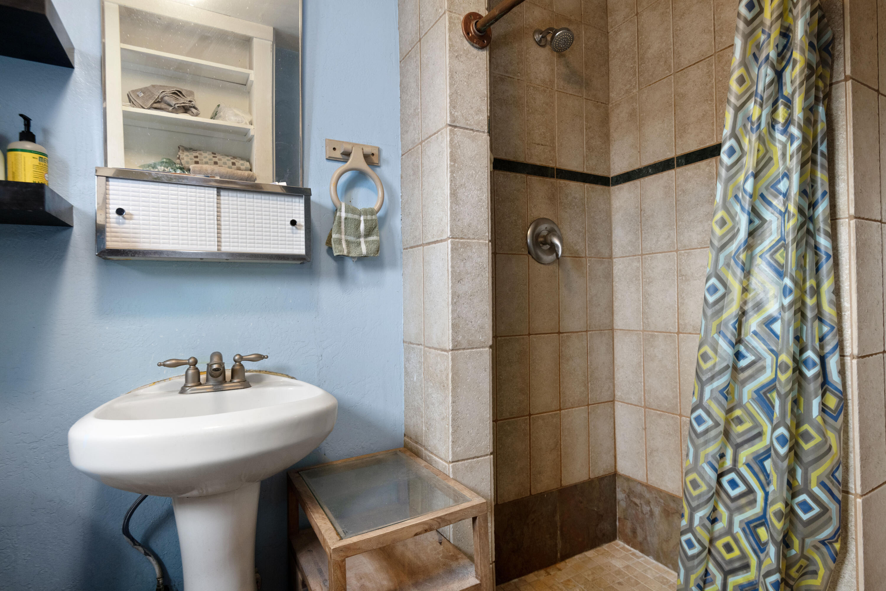 243 West Adams Avenue Sisters, OR 97759 - Photo 9 of 19 a bathroom with a sink and a mirror