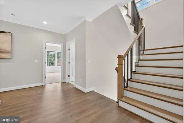 a view of balcony with wooden floor and fence