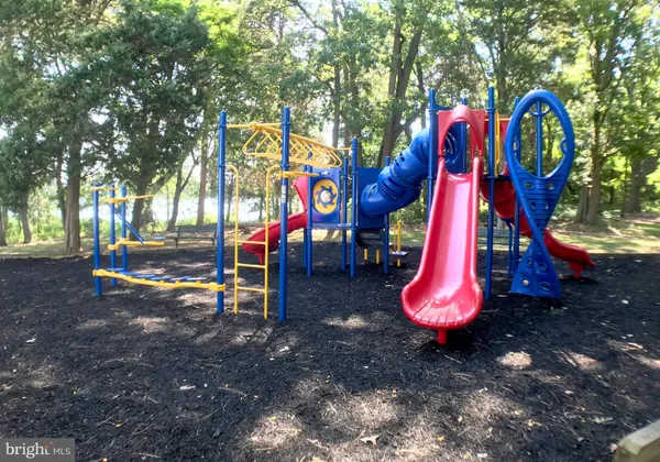a view of a park with slide and a slide