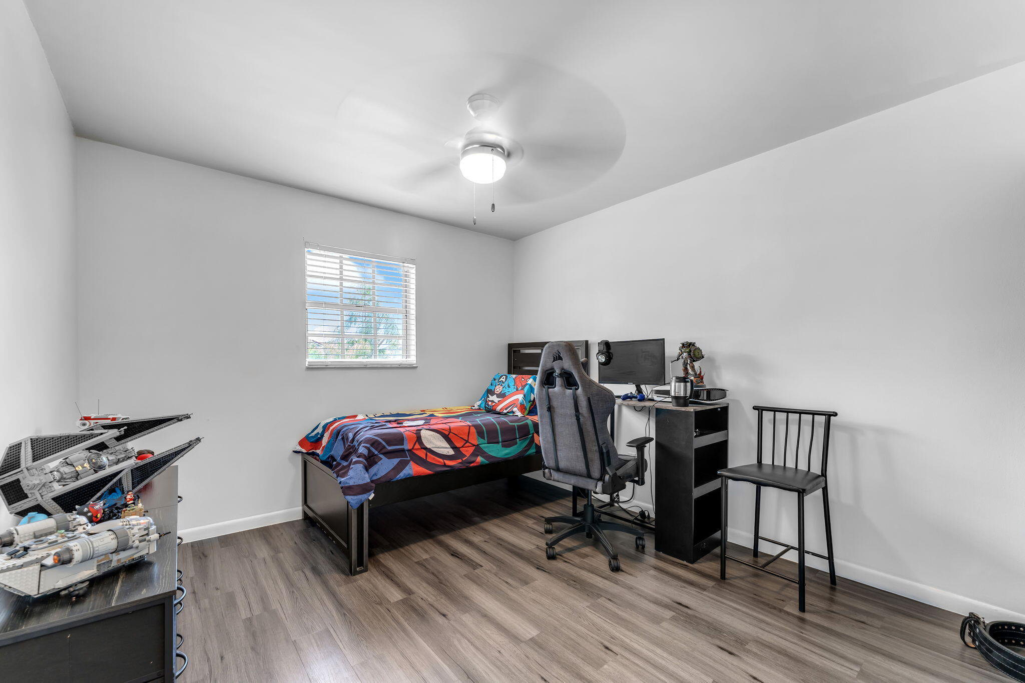13860 Southwest 102nd Terrace Miami, FL 33186 - Photo 14 of 39 a bedroom with furniture and a wooden floor