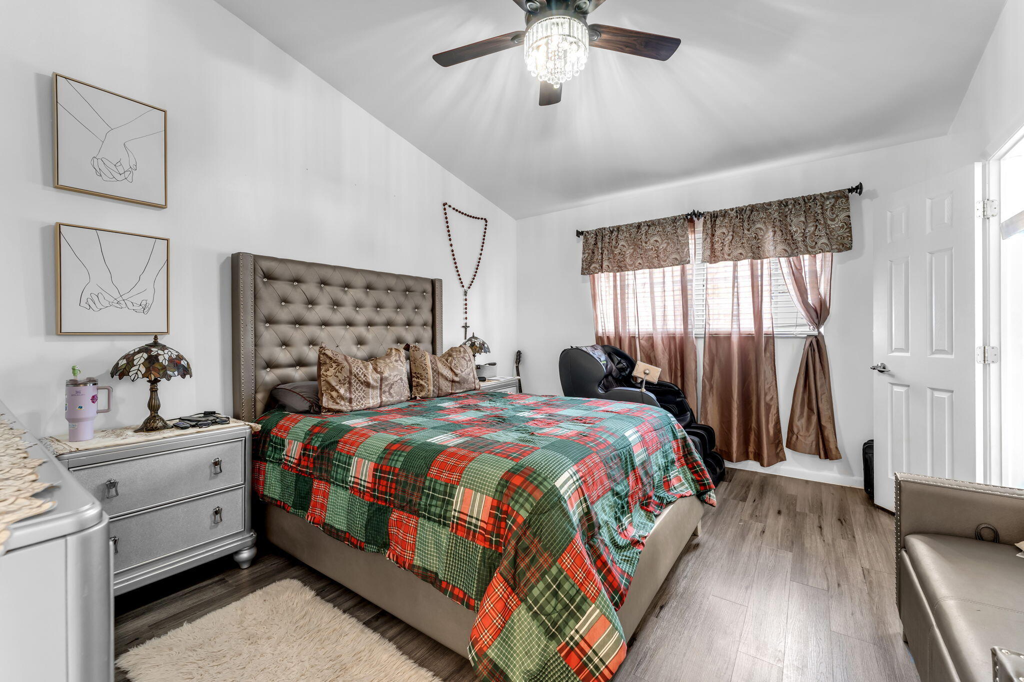 13860 Southwest 102nd Terrace Miami, FL 33186 - Photo 18 of 39 a bedroom with a bed and a chandelier