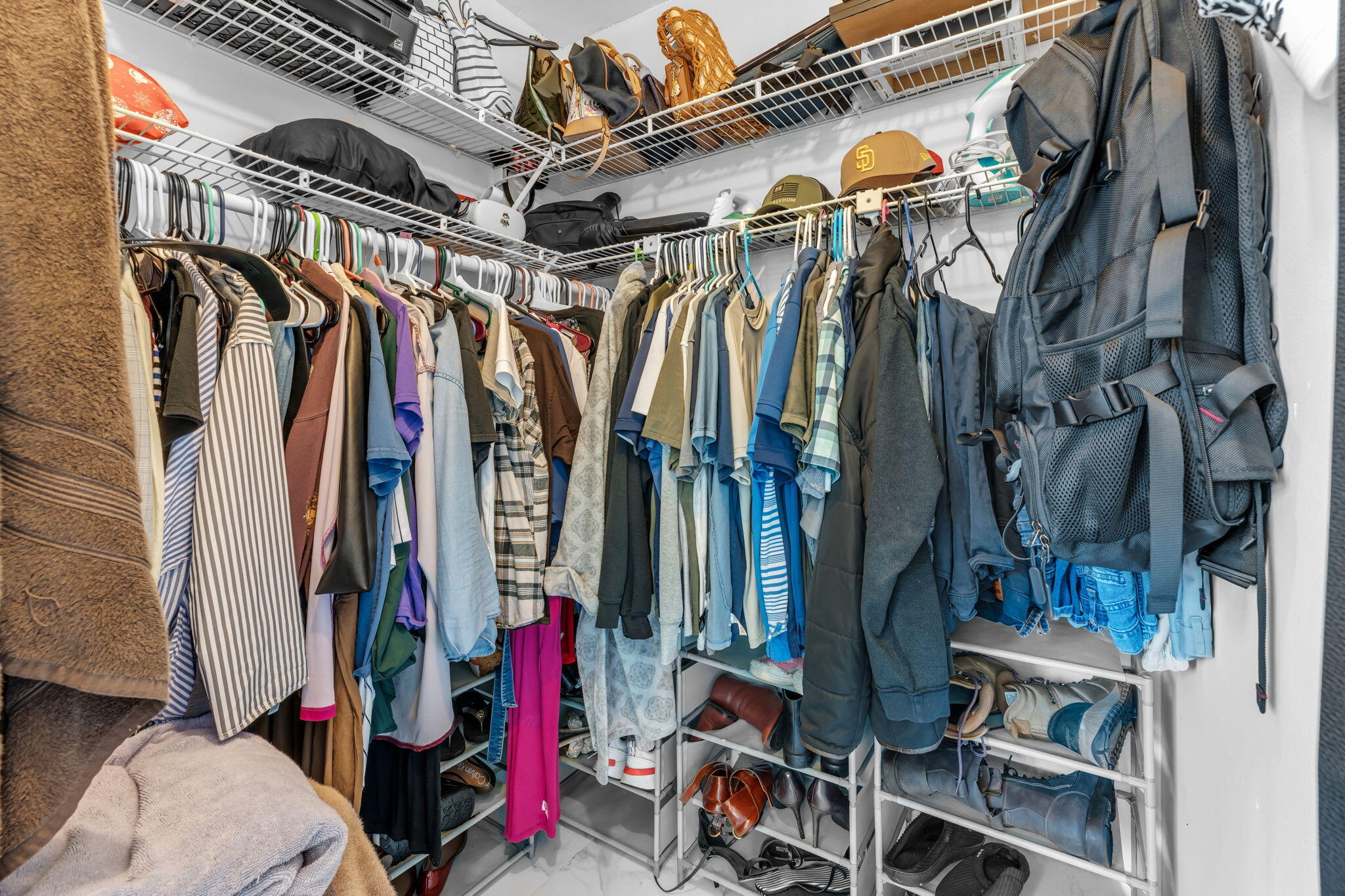 13860 Southwest 102nd Terrace Miami, FL 33186 - Photo 22 of 39 a view of walk in closet with clothes and shoes