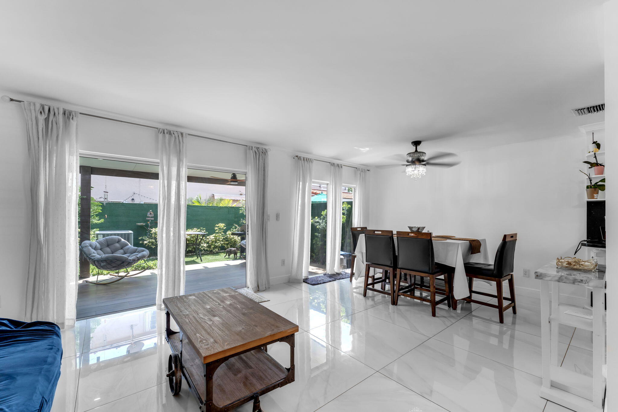 13860 Southwest 102nd Terrace Miami, FL 33186 - Photo 5 of 39 a living room with furniture and a large window