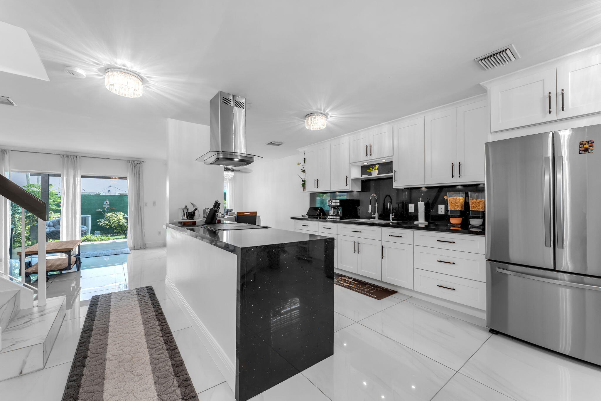 13860 Southwest 102nd Terrace Miami, FL 33186 - Photo 6 of 39 a kitchen with stainless steel appliances granite countertop a refrigerator a sink dishwasher a stove and white countertops with wooden floor