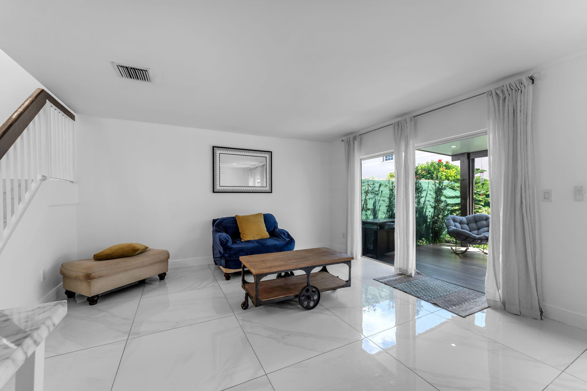 13860 Southwest 102nd Terrace Miami, FL 33186 - Photo 10 of 39 a living room with furniture and a window