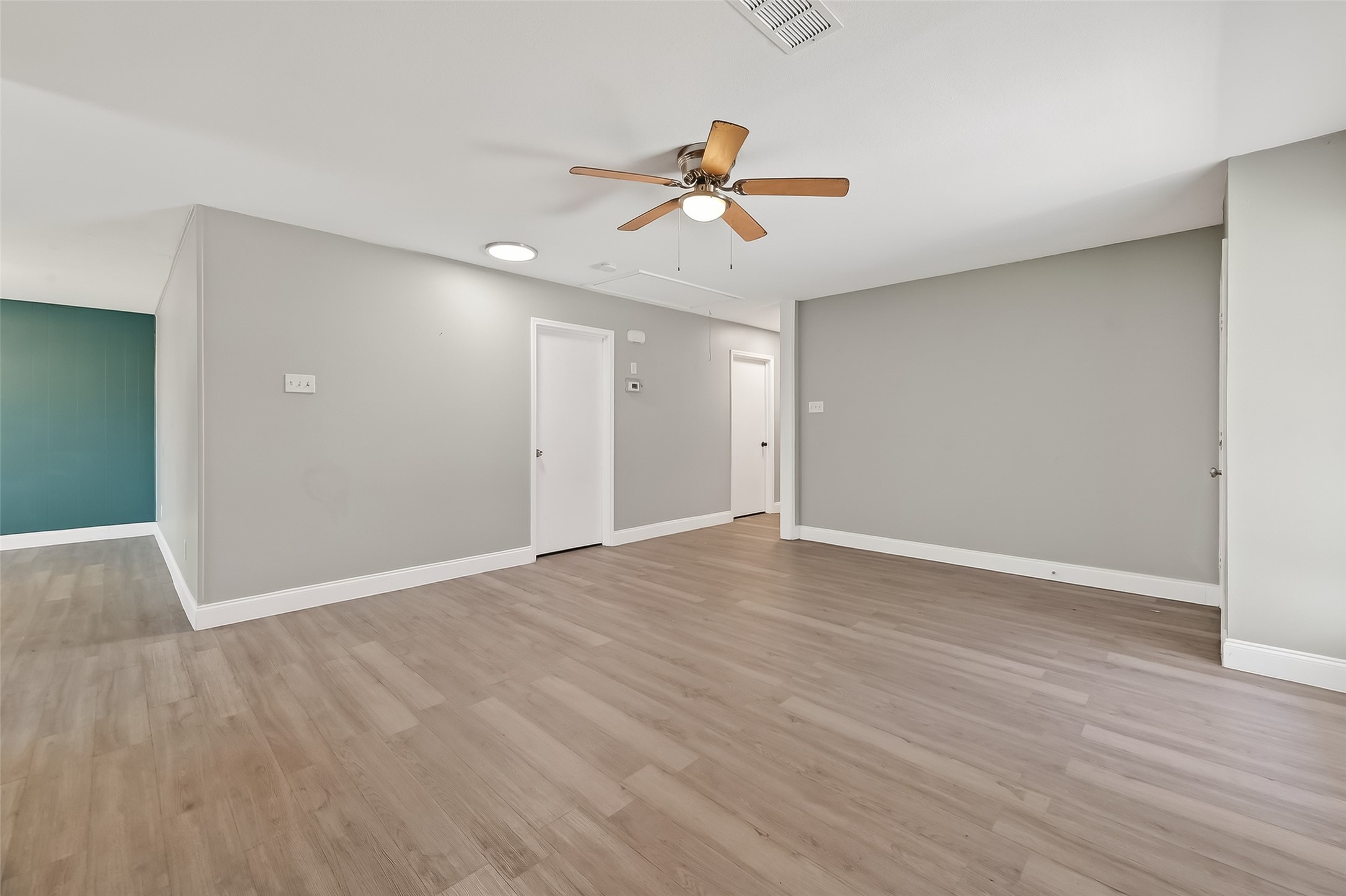 12211 Chimney Rock Road Houston, TX 77035 - Photo 14 of 27 a view of empty room with wooden floor