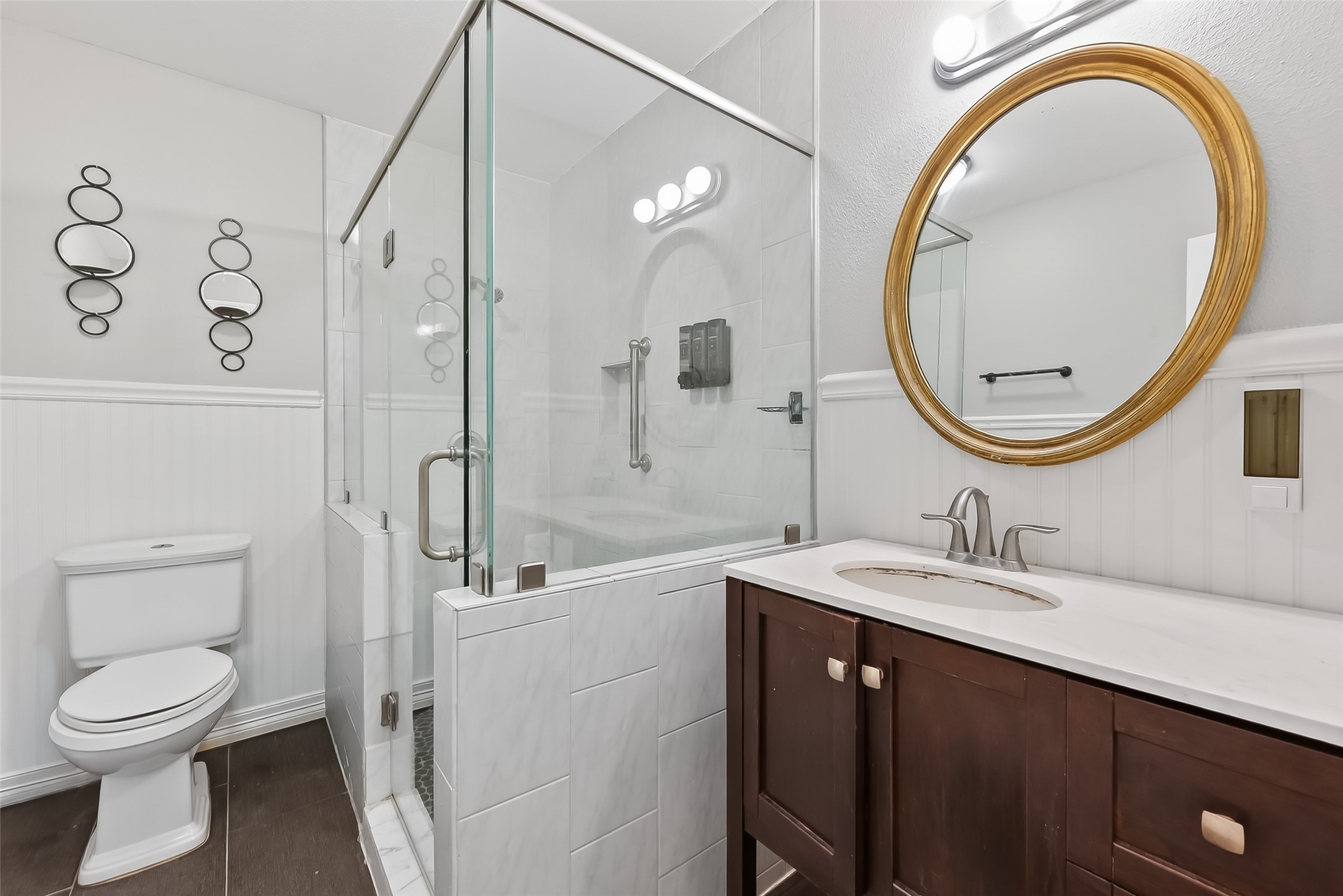 12211 Chimney Rock Road Houston, TX 77035 - Photo 17 of 27 a bathroom with a sink a toilet and a mirror