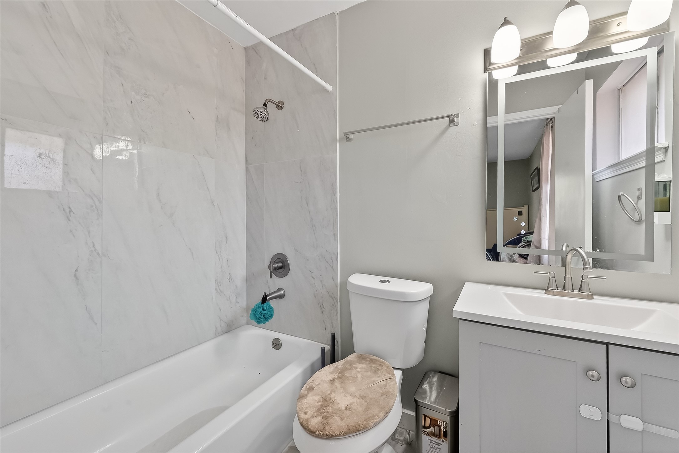 12211 Chimney Rock Road Houston, TX 77035 - Photo 19 of 27 a bathroom with a sink toilet and shower