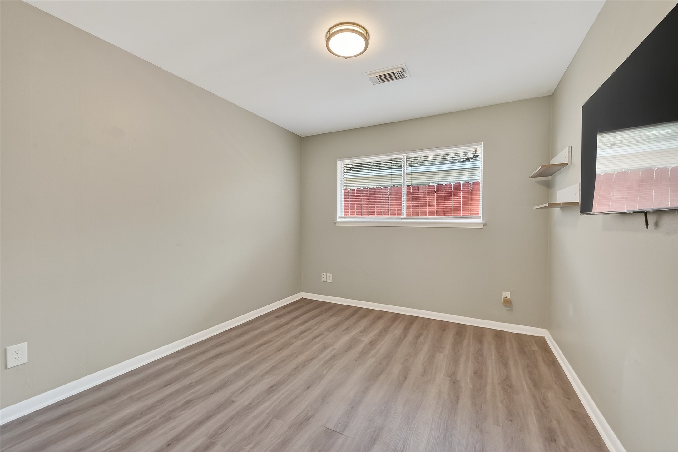 12211 Chimney Rock Road Houston, TX 77035 - Photo 21 of 27 wooden floor in a room