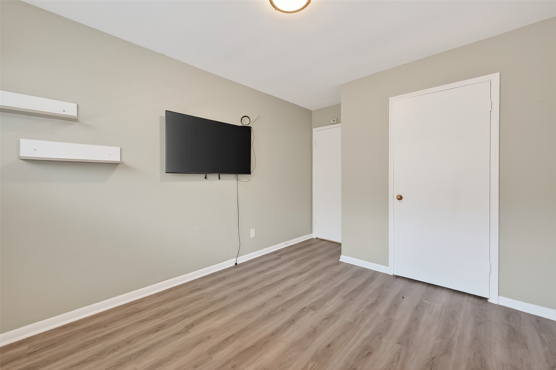 12211 Chimney Rock Road Houston, TX 77035 - Photo 22 of 27 a view of a livingroom with wooden floor