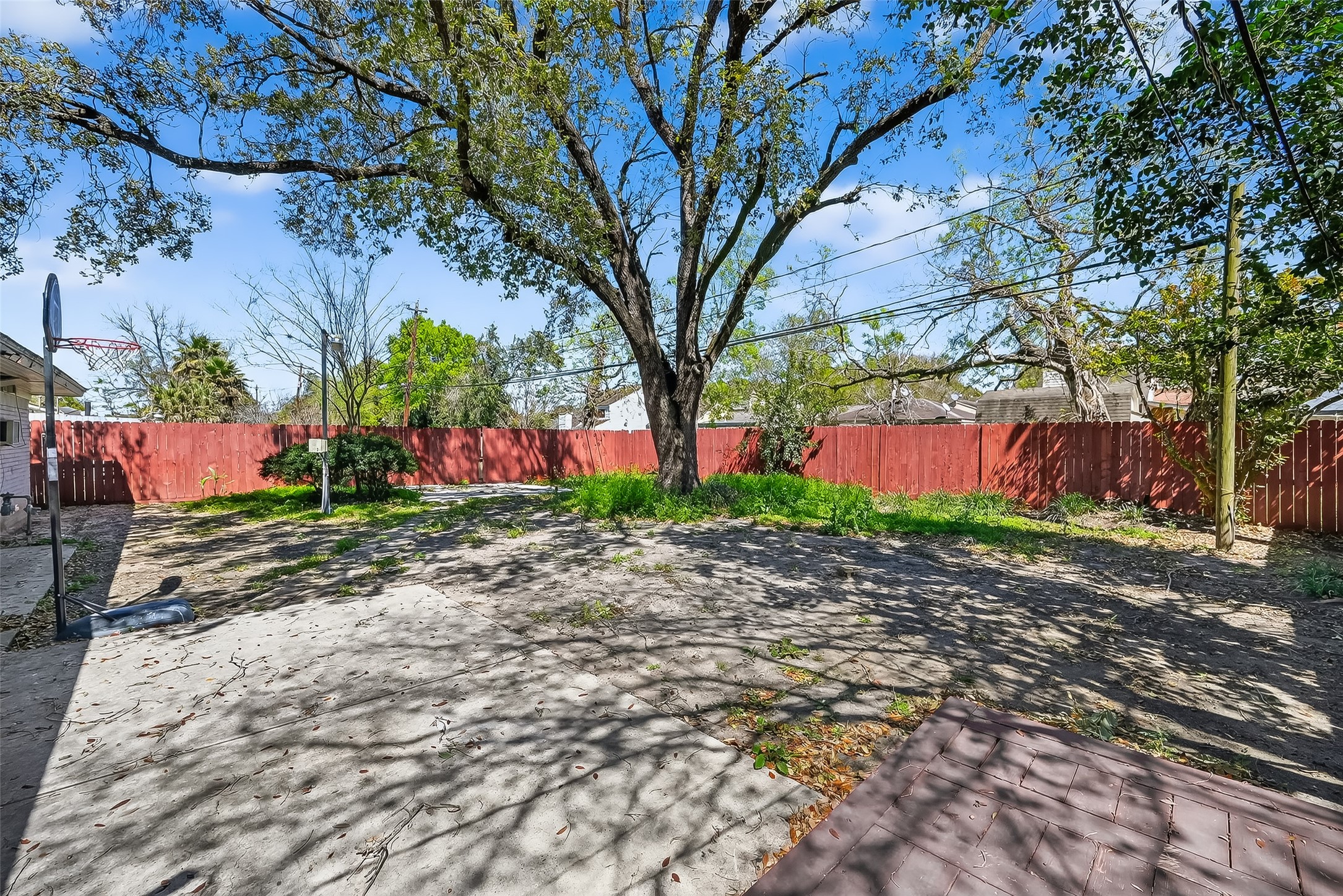 12211 Chimney Rock Road Houston, TX 77035 - Photo 23 of 27 a backyard of a house with lots of green space