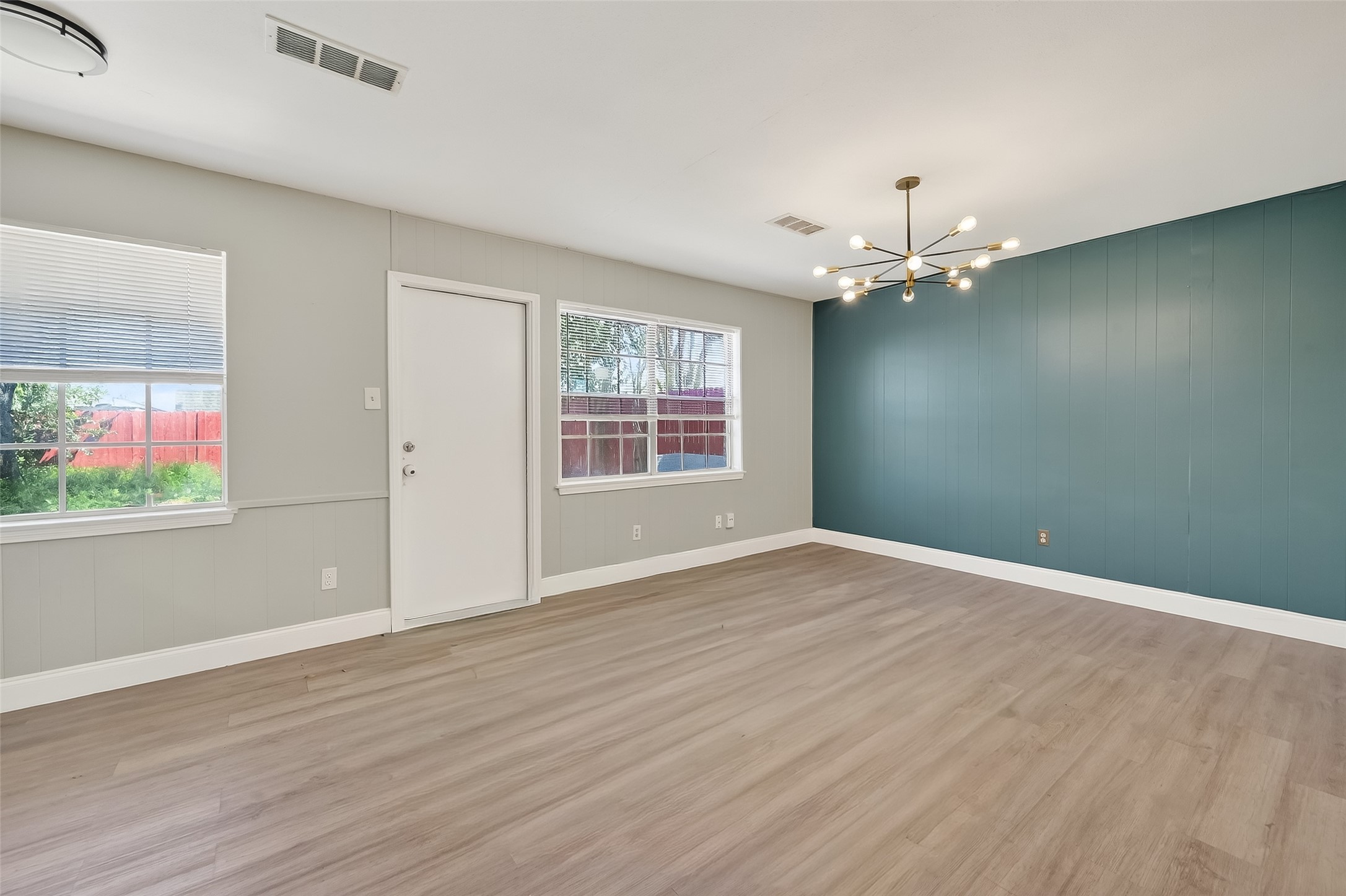12211 Chimney Rock Road Houston, TX 77035 - Photo 5 of 27 wooden floor in an empty room with a window
