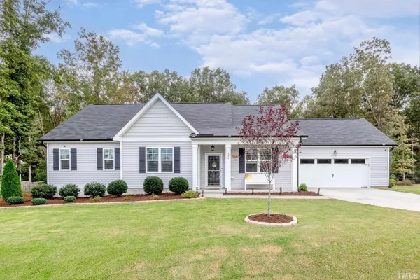 front view of a house with a yard