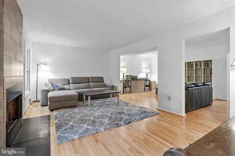 a living room with furniture and a rug
