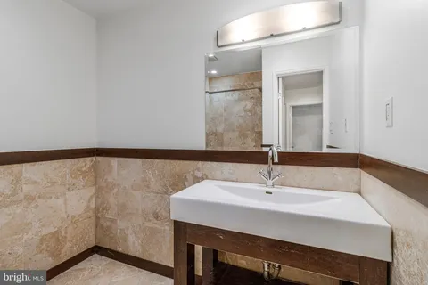 a bathroom with a shower and a bath tub