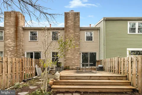a view of a street that has couple of cars parked on the road