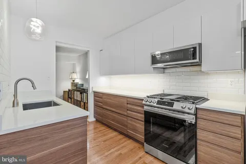 a kitchen with a stove and a microwave