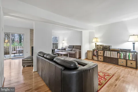 a kitchen with stainless steel appliances granite countertop a sink stove and wooden floor