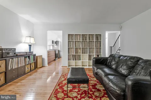 a living room with furniture and a rug