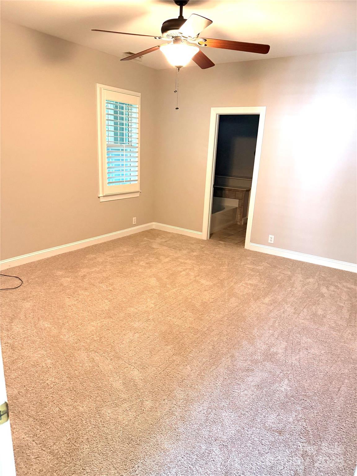 18845 Cloverstone Circle Cornelius, NC 28031 - Photo 11 of 25 an empty room with windows and fan