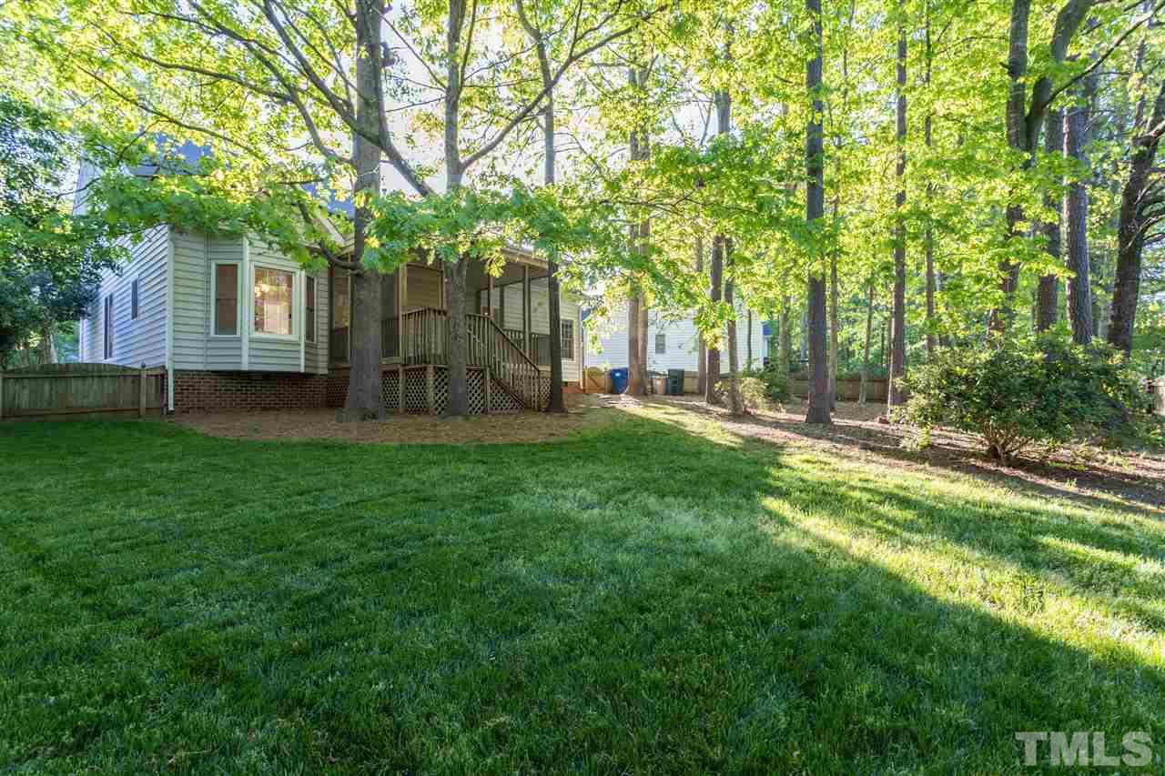 3305 Glade Spring Court Raleigh, NC 27612 - Photo 2 of 20 a garden view with a seating space