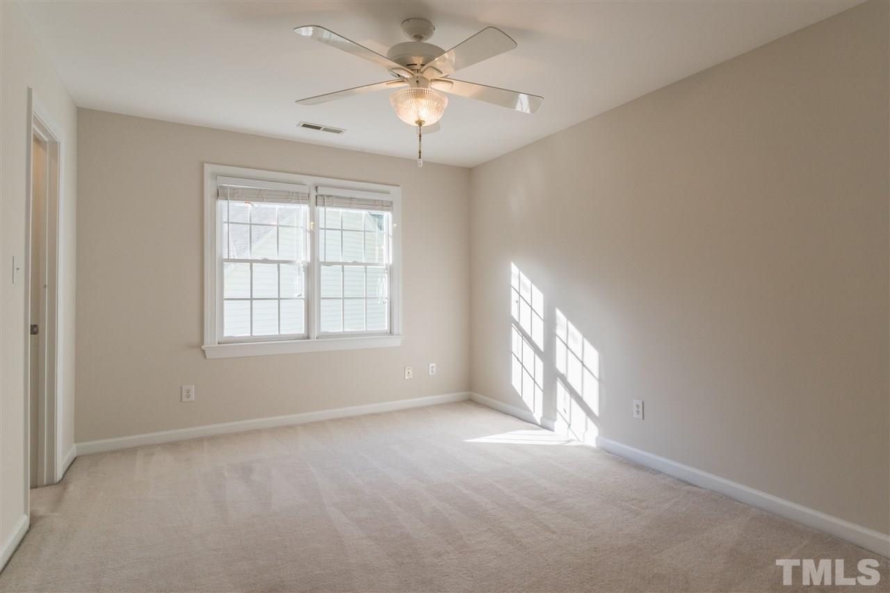3305 Glade Spring Court Raleigh, NC 27612 - Photo 18 of 20 an empty room with windows and fan