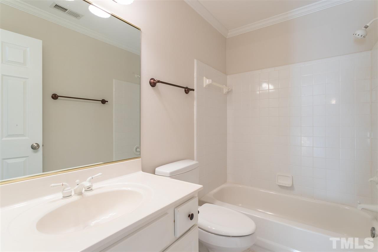 3305 Glade Spring Court Raleigh, NC 27612 - Photo 19 of 20 a bathroom with a sink toilet and shower