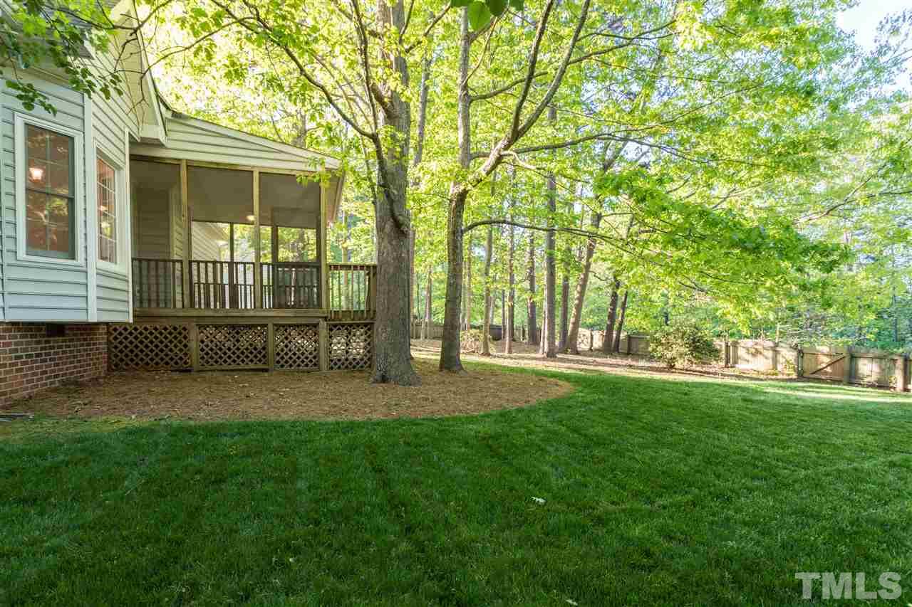 3305 Glade Spring Court Raleigh, NC 27612 - Photo 3 of 20 a view of a yard with a house and large trees