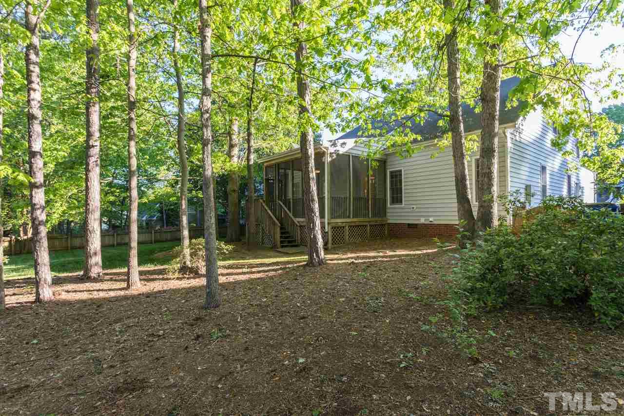 3305 Glade Spring Court Raleigh, NC 27612 - Photo 4 of 20 a view of a house with backyard and a tree